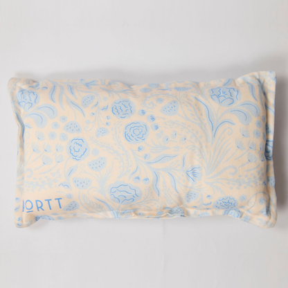 Port pillow with blue floral pattern on light background