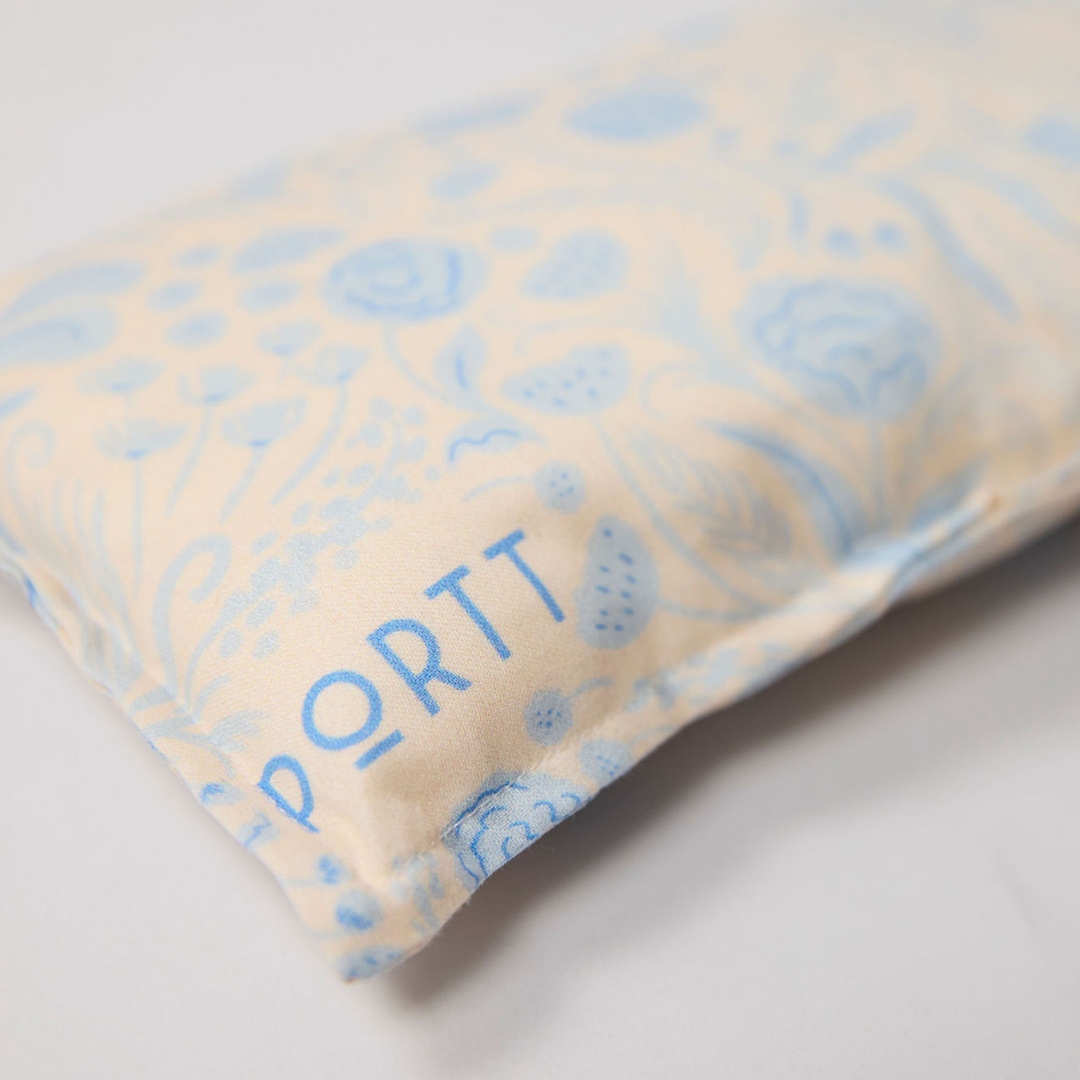 Port pillow with blue floral pattern on light background