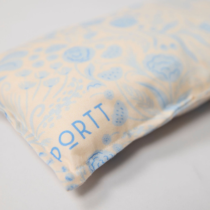 Port pillow with blue floral pattern on light background